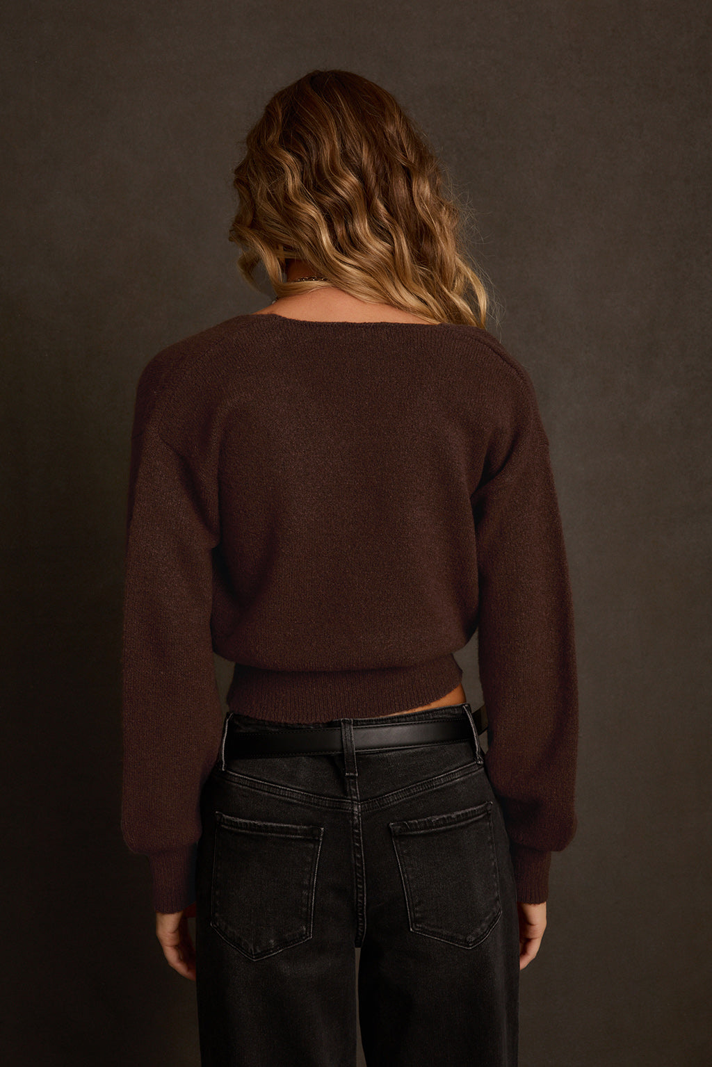 Fall sweater side angle showing dolman sleeve and wrap-front construction