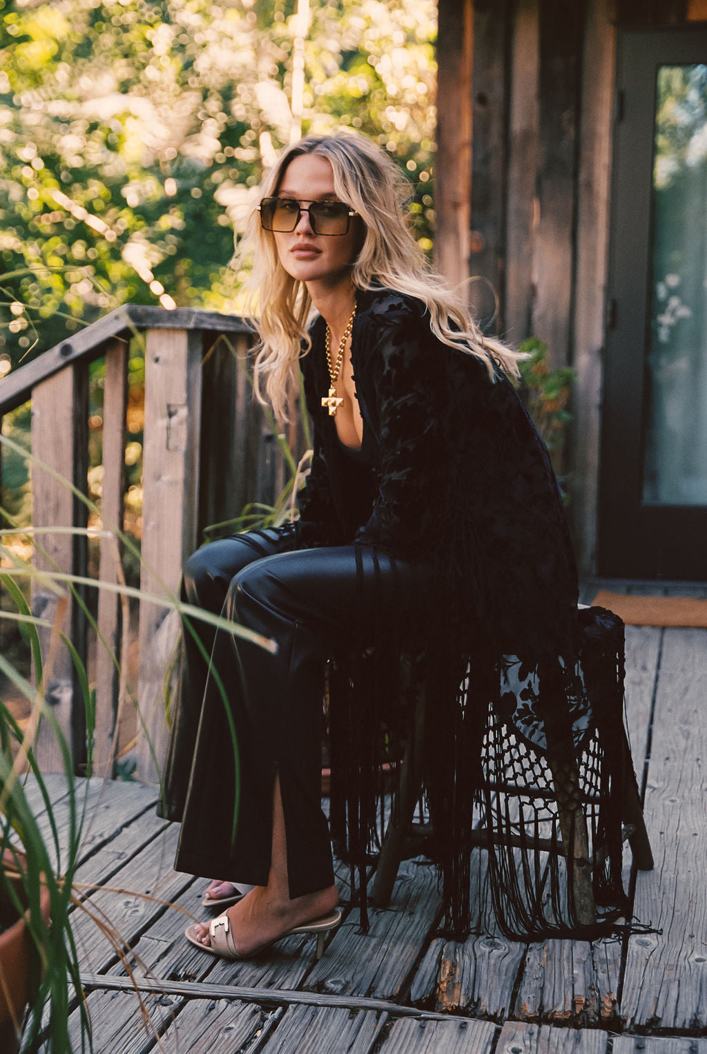 Back view of the black velvet piece showing the silhouette and fit.