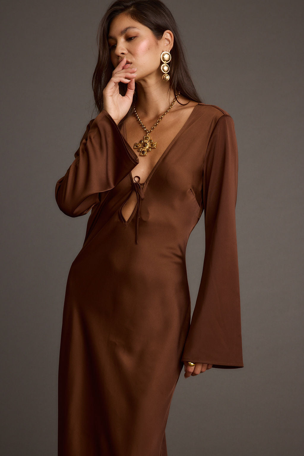 Strokes Mocha Long Sleeve Plunge Satin Maxi Dress paired with complementary accessories for a polished look.