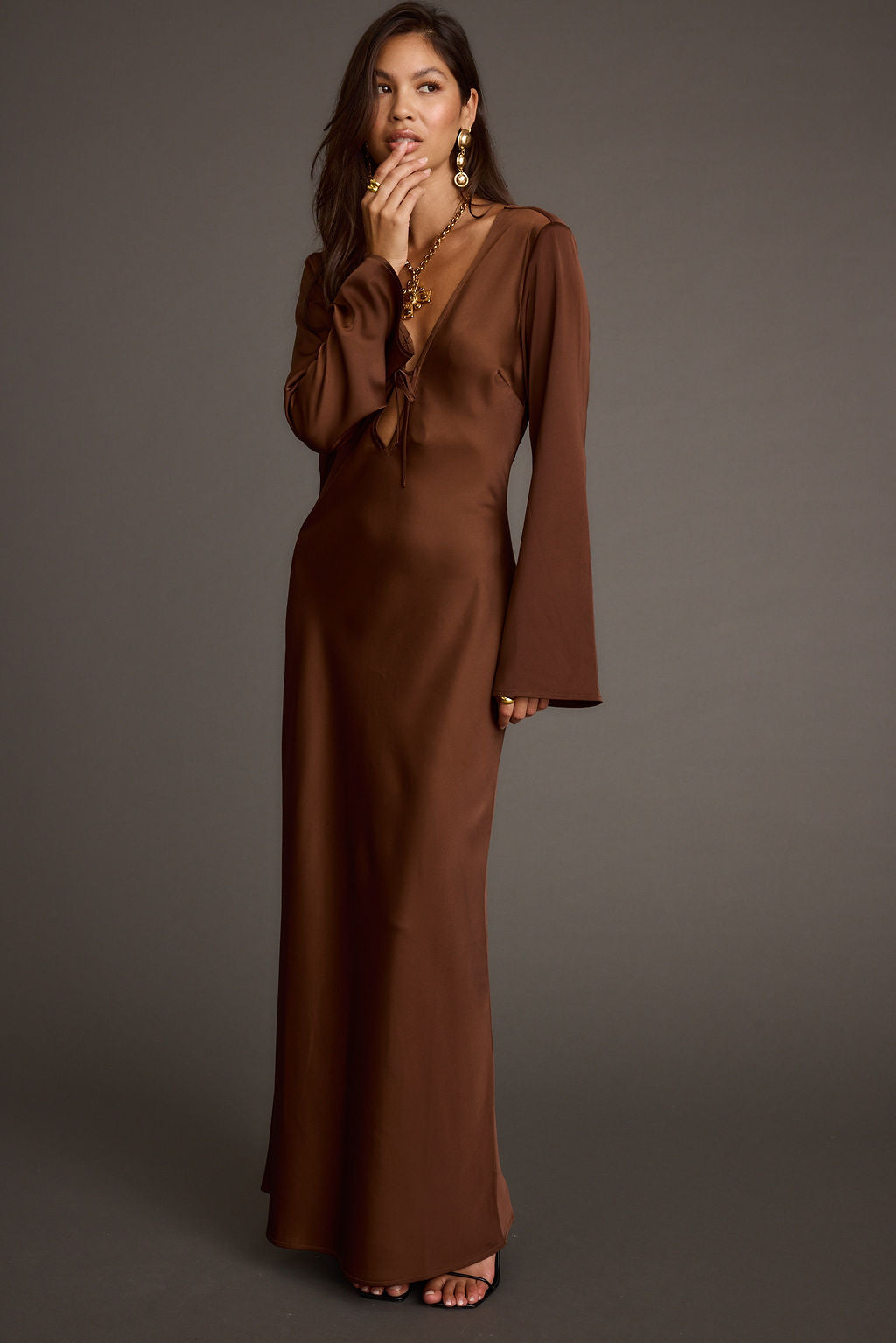 Detail shot of the Strokes Mocha Long Sleeve Plunge Satin Maxi Dress highlighting the satin elements.