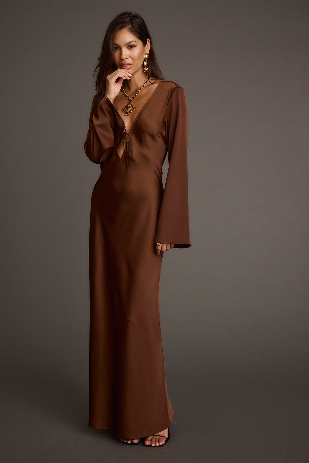 Strokes Mocha Long Sleeve Plunge Satin Maxi Dress styled in a complete look from an alternate angle.