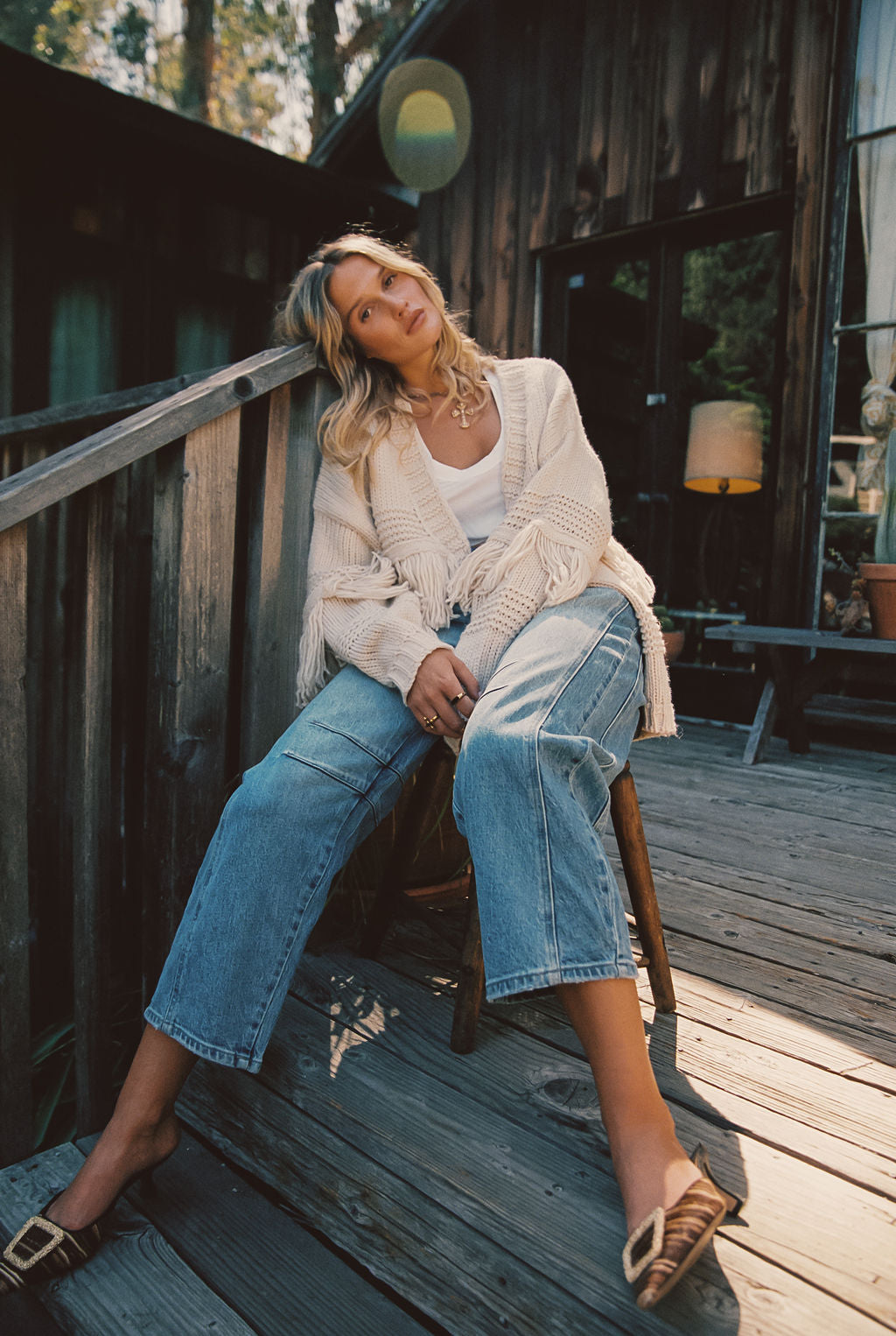 Close-up of the Sunny Beige Fringe Cardigan showcasing the fringe texture and craftsmanship.