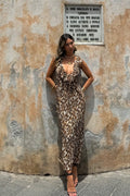 Lifestyle shot of the leopard print maxi dress styled for day-to-night versatility.