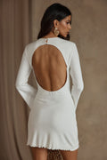 White dress with elegant accents, a white sequin dress essential.
