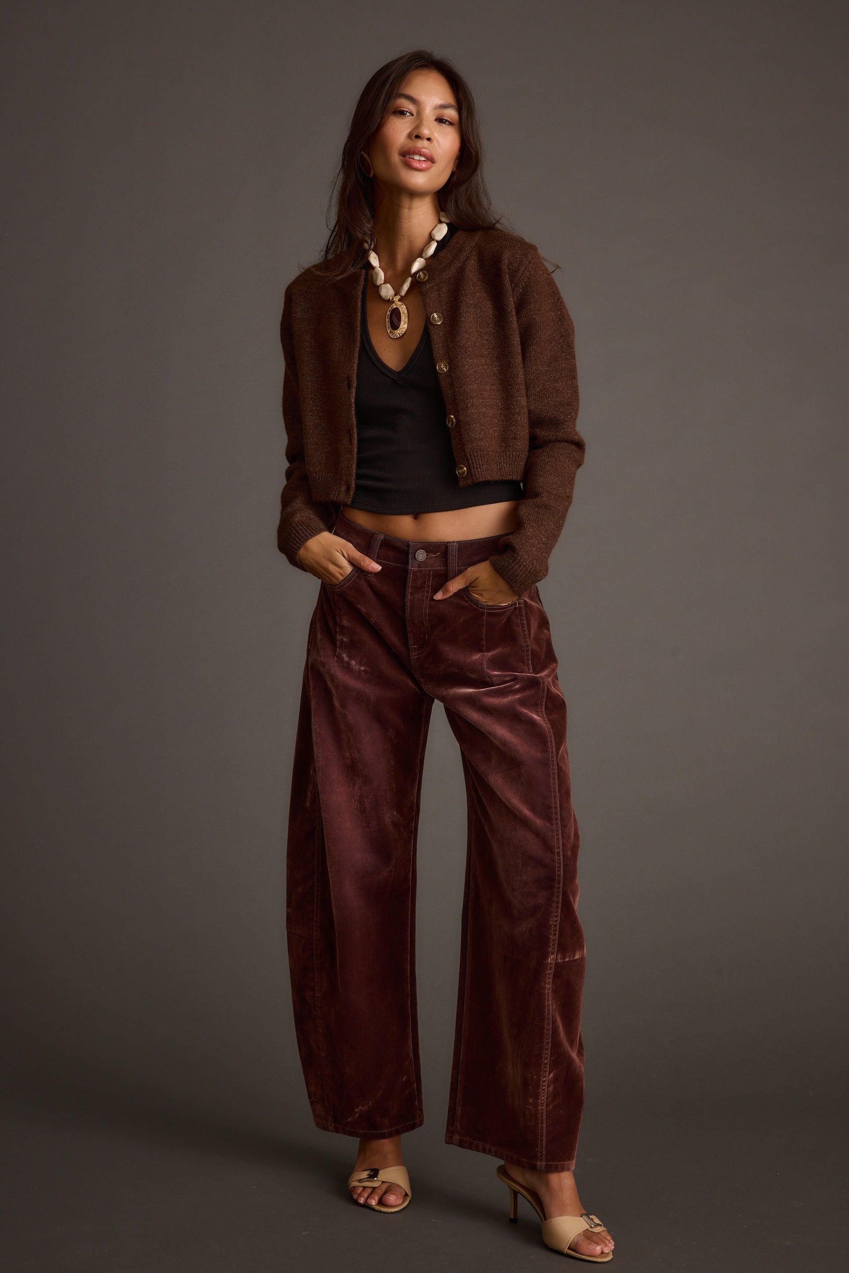 Lifestyle shot of the mocha cardigan styled for day-to-night versatility.