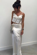 Satin and lace maxi skirt with accents and a flattering silhouette.