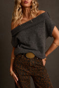 Asymmetrical sweater in charcoal with fold-over off-shoulder neckline, leopard jeans, oval belt