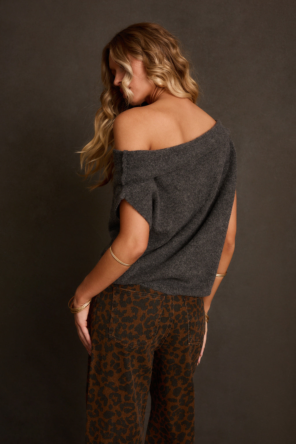Off-shoulder sweater back view showing clean back panel and cropped length