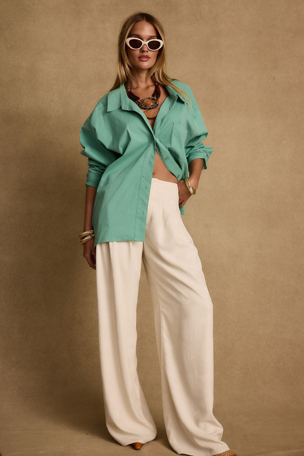 Close-up of the Vacanza Mint Button Up Top showcasing the fabric texture and design details.