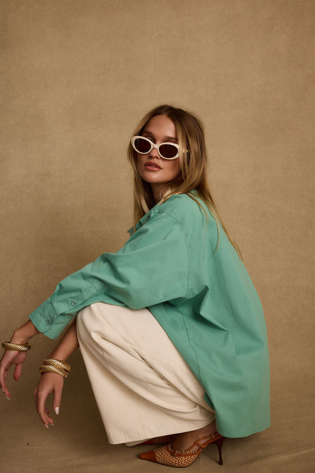 Detail shot of the Vacanza Mint Button Up Top highlighting the design elements.