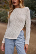 White sheer top with sheer accents, a white feather top essential.