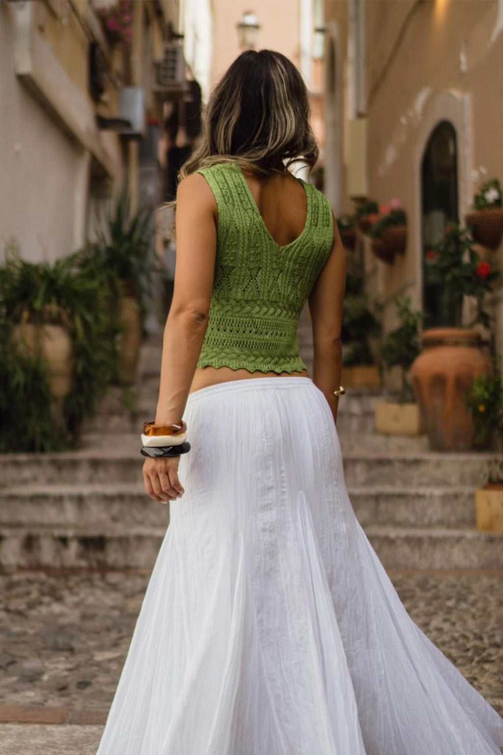 Full-length view of the tank top showing the drape and movement.