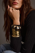 Gold piece with refined detailing and a flattering silhouette.