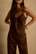Espresso brown floral satin tank styled with matching pants and gold bangles for vacation.