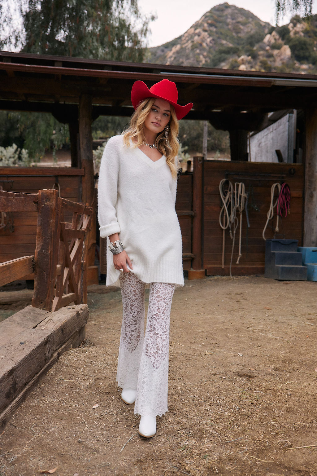 Olivia White V-Neck Sweater Dress paired with complementary accessories for a polished look.