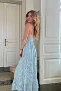 Blue maxi dress with elegant accents, a vacation maxi dress essential.