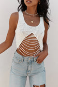 White crochet open-knit tank with pyramid cutout detail, styled with light-wash denim.