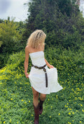 White strapless dress with elegant accents, a white sequin dress essential.