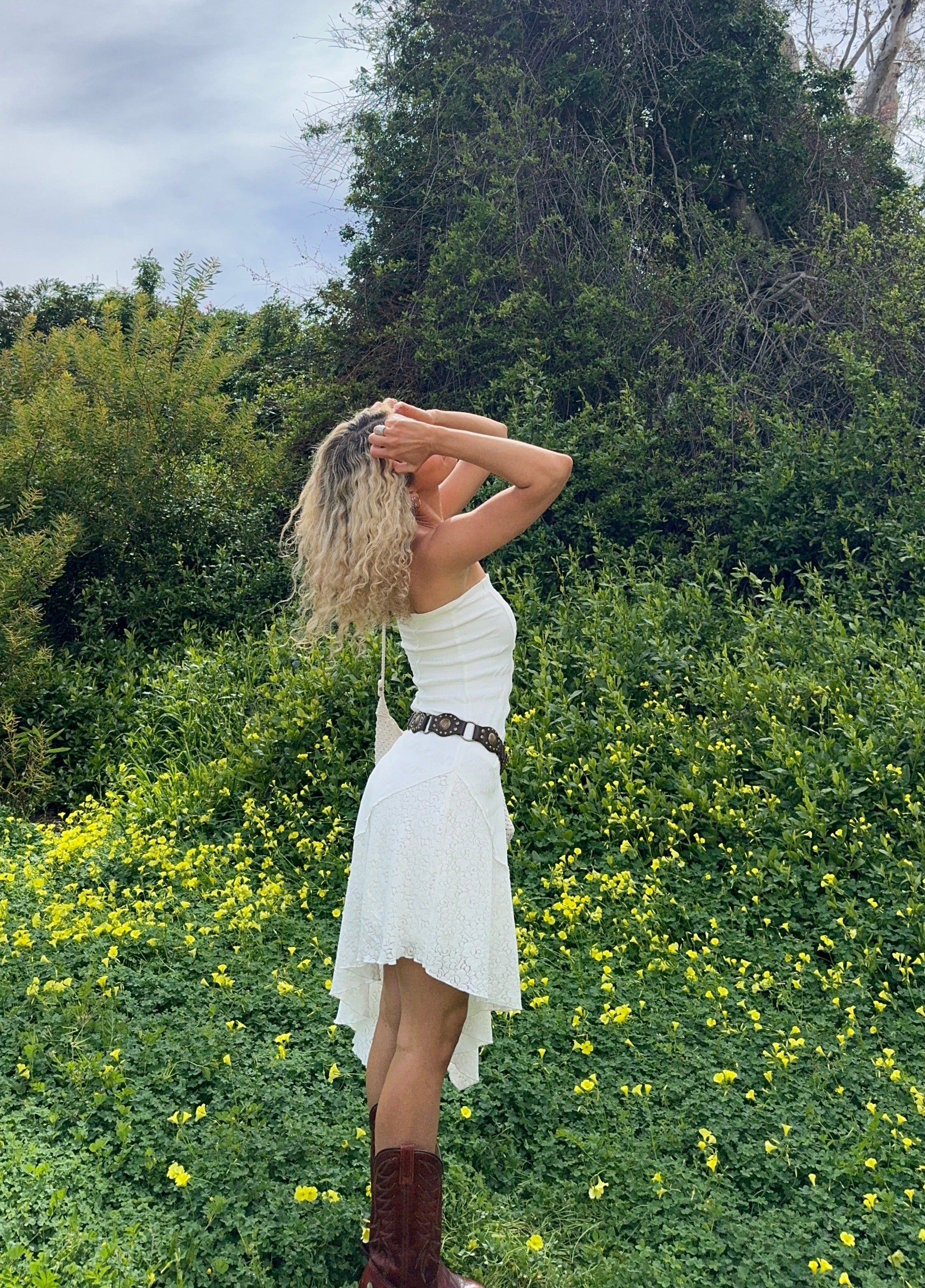 Back view of the white dress showing the silhouette and fit.