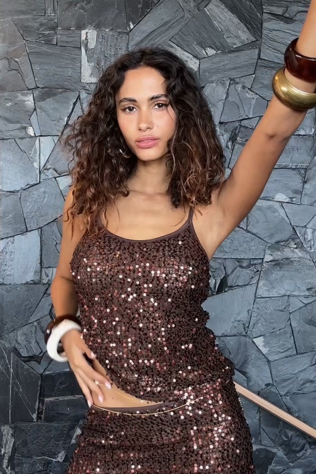 Back view of the sequin piece showing the silhouette and fit.