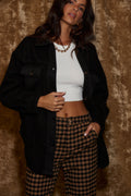 Black shirt with refined detailing and a flattering silhouette.