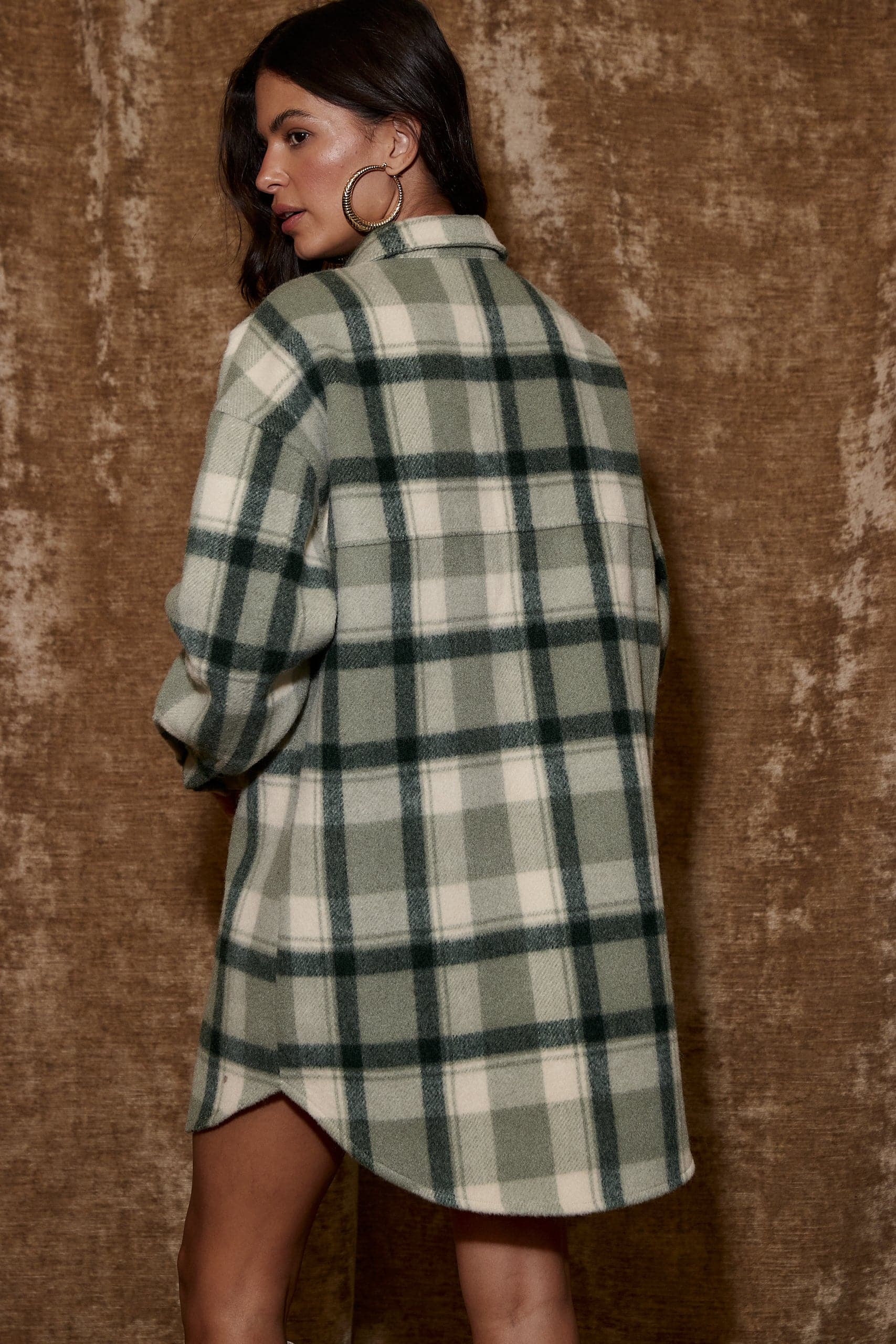 Product view of the Kellan Emerald Plaid Mini Dress showcasing versatility and wearability.