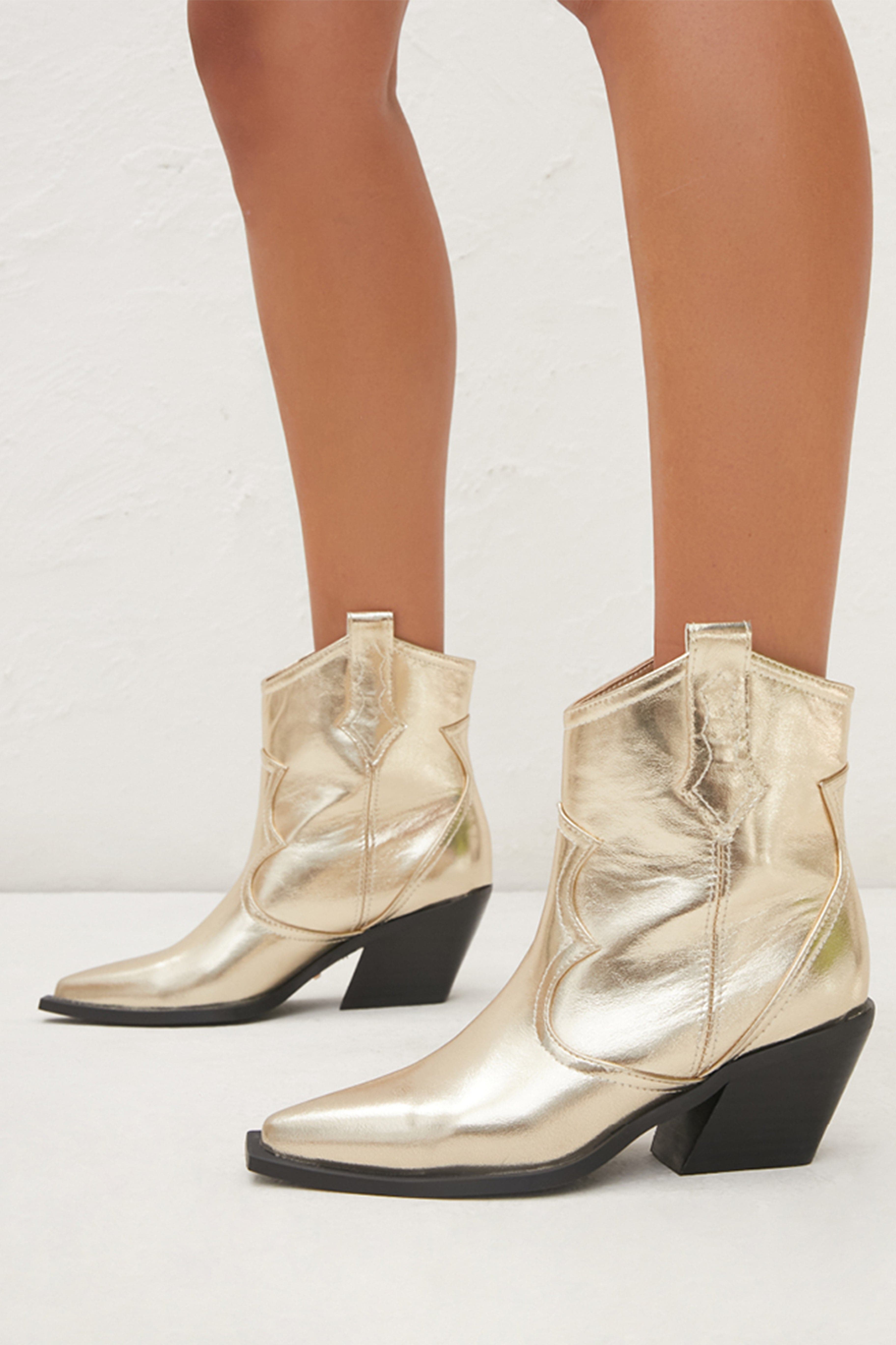 Billini Ulira Gold Metallic Boot paired with complementary accessories for a polished look.
