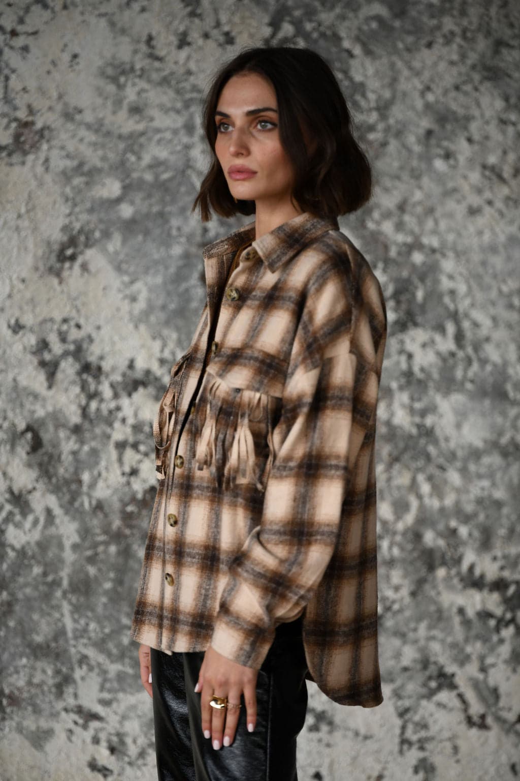 Detail shot of the Devin Brown Fringe Shacket highlighting the fringe elements.